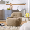 Sits Uma Armchair Upholstered in Fabric or Leather
